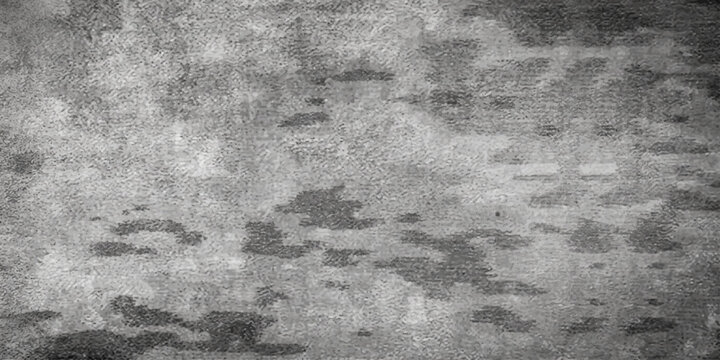 Rough aged concrete wall with a dark gray grunge texture and dirty stone surface creates a vintage textured paper pattern for a grungy cement backdrop design