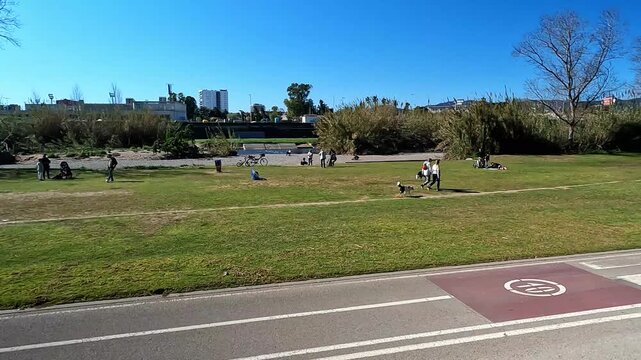 Barcelona, Spain - May 10, 2026: Dogs And People At Besos Park