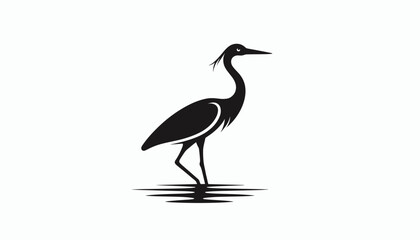 Fototapeta premium Silhouette of a heron standing in water.
