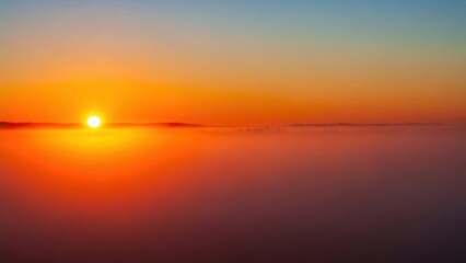 Obraz premium Sunset over a sea of fog