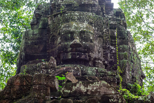 Carved face of Avalokiteshvara on Ta Som temple tower, Angkor.