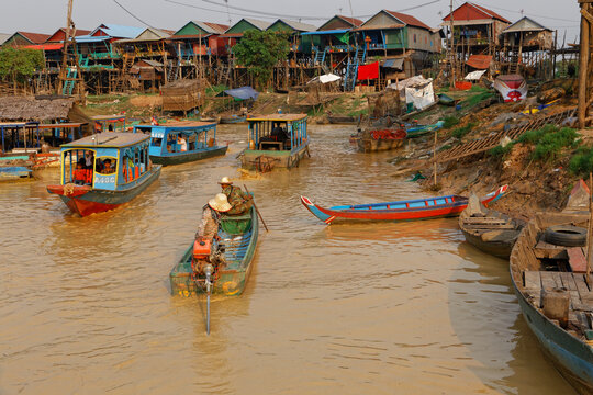 Kompong Phluk stilt houses and traditional boats, scenic waterway in Siem Reap, Cambodia.