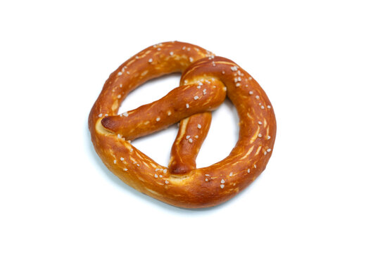 Freshly baked pretzel on isolated white background, Top view.