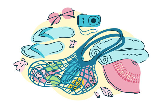 Beach composition with a string bag on the sand, Panama hat, towel, slippers and camera, summer accessories for a beach holiday in blue and pink colors