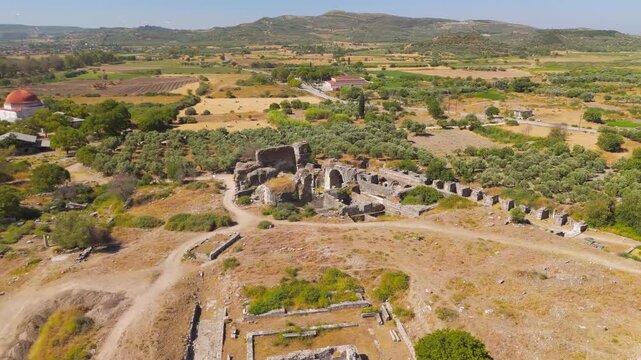 Balat, Turkey. The Baths of Faustina, massive stone ruins of the largest Roman bathing complex in Miletus, aerial view over the archaeological site under bright summer sun. Aerial View, Point of inte