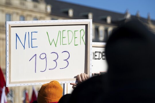 Pictures taken during the demonstration Haltung zeigen! against Nazi deportation plans of the AfD on the Schlossplatz in Stuttgart, 20.01.2024. A sign with the inscription Never again 1933