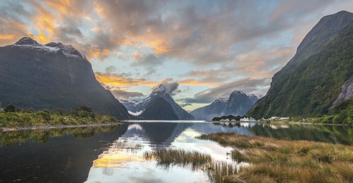 Mitre Peak reflecting in the water, sunset, Milford Sound, Fiordland National Park, Te Anau, Southland Region, Southland, New Zealand