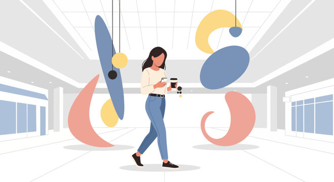Woman walking in modern shopping mall with abstract art installations and coffee
