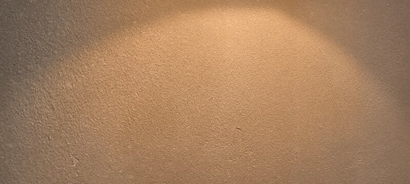 The yellow light hits the wall.
