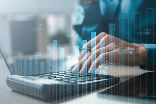 Close-up of professional using calculator with digital charts overlay, symbolizing financial analysis, investment planning, accounting audit, AI forecasting, market growth, and business performance.
