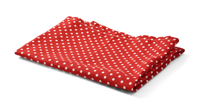 Vibrant red kitchen towel with white polka dots, neatly folded against a white background. Kitchen napkin isolated.