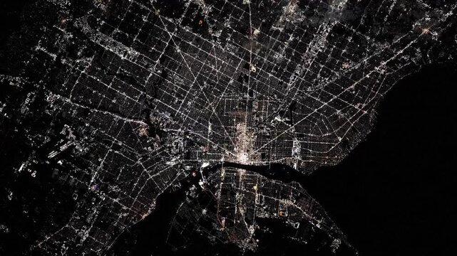 Flying over Detroit city lights at night satellite view from space based on Nasa imagery