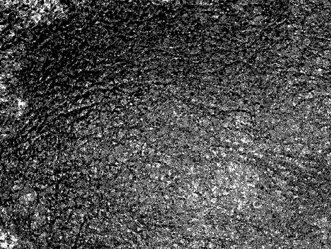 Texture of Dark Metal: A close-up view reveals a textured surface of dark metal, where light and shadow dance creating an industrial and abstract feel.