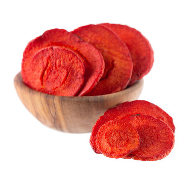 Crispy roasted carrot chips with sea salt, isolated on white background. Healthy and crunchy natural vegetable snack. Clipping path.