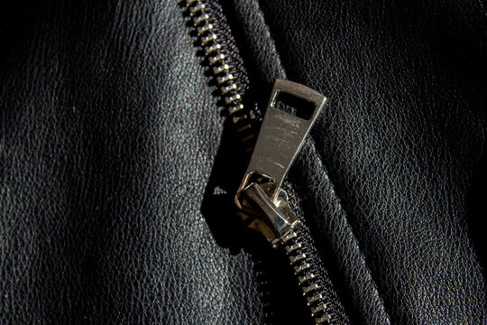 Zipper detail on black leather jacket texture