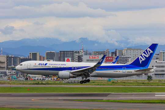 Fukuoka Japan - 2022 July 22: An All Nippon Airways (ANA) Boeing 767-300ER (JA623A) flying low over the runway just before landing at Fukuoka Airport.