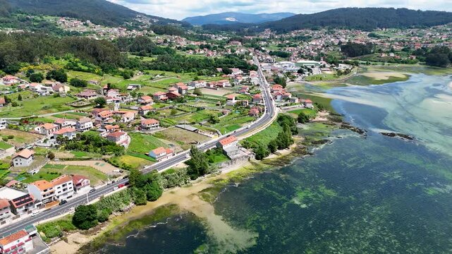 Aerial view of coastal town landscape beside an estuary