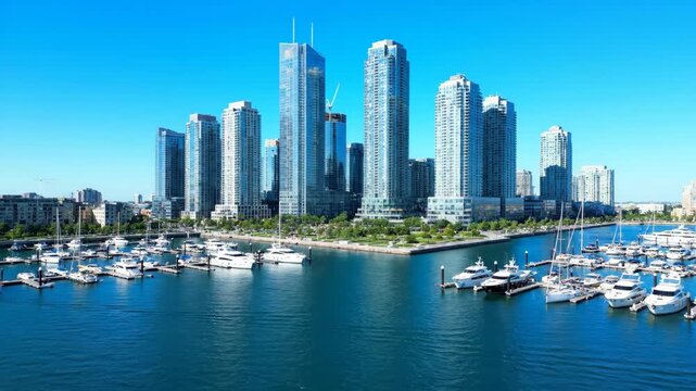 Modern Skyscrapers and Marina View - Aerial view of modern skyscrapers in a vibrant cityscape, showcasing urban architecture and waterfront luxury from above.