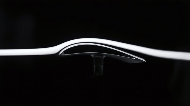 Laminar air flow profile over an airplane wing section during wind tunnel testing on black background.