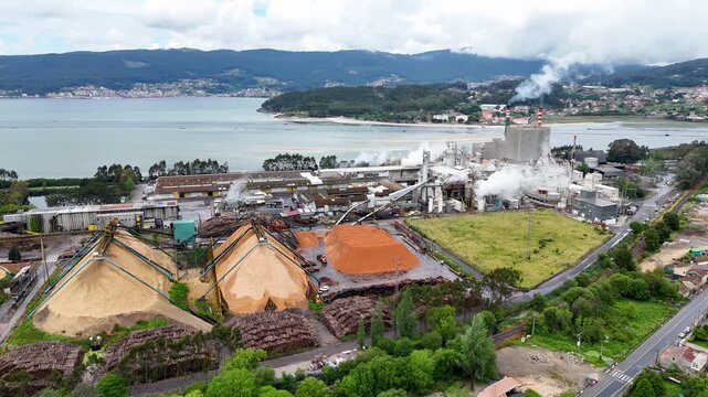 Industrial pulp and paper mill production plant aerial view