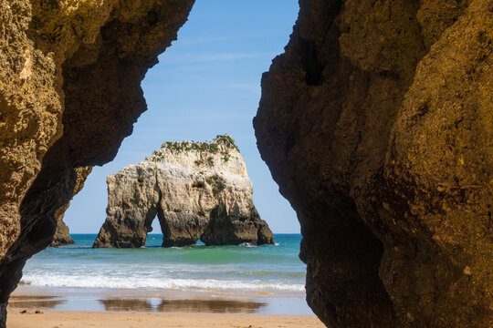 Beach photographed through the rock cut in Algarve - Portugal