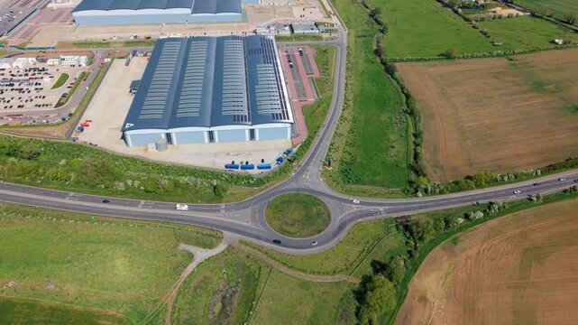 Aerial view of a massive logistics park and mega distribution warehouses, Kettering, UK