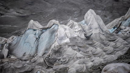 Rhone glacier covered in white protective fleece blankets to slow melting in Swiss Alps © Nils
