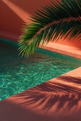 Obraz premium Palm frond casting shadow over pool corner with coral wall