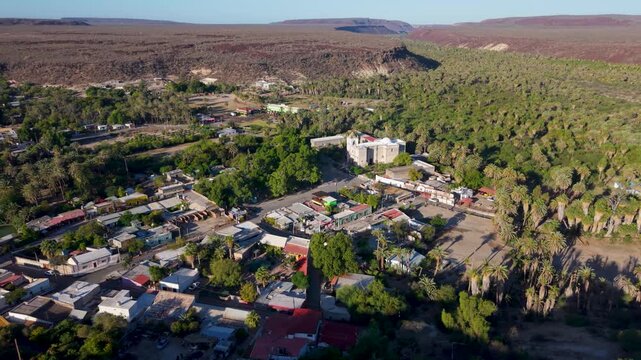 See the aerial views of Mission Church in San Ignacio, Baja California, Mexico, showcasing the oasis town and its natural beauty.