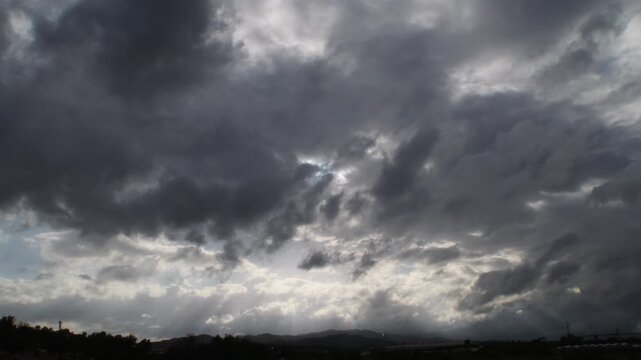 Clouds moving in a cloudy day at sunset. Time Lapse. 4K Vertical