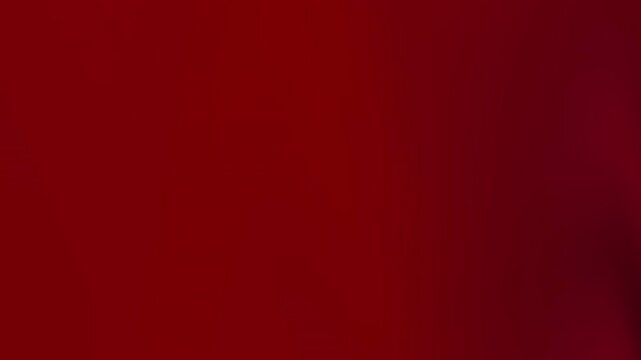 Deep red abstract motion background with smooth gradient shifts