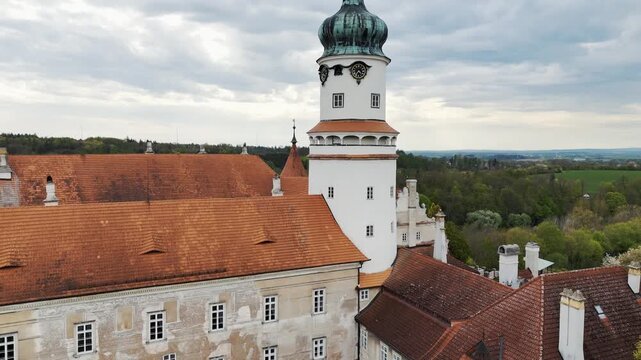 Aerial View of Nove Mesto nad Metuji Castle Complex with White Tower and Red Roofs