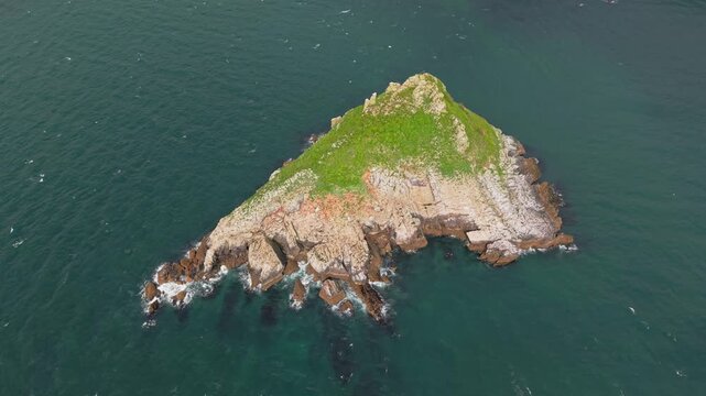 Aerial view of Thatcher Rock, Historical landmark in the United Kingdom. Thatcher Rock is a key sites for studies of Quaternary stratigraphy and sea-level change and forms part of the English Riviera.