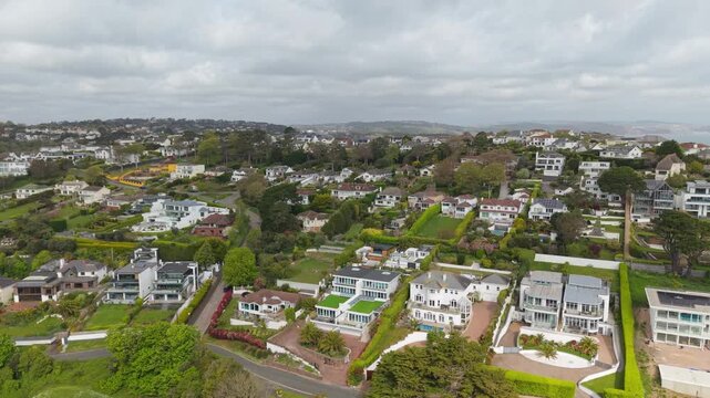 Aerial view of Torquay town. Torquay is a seaside resort town on the English Channel in Devon, south west England. Known for beaches such as Babbacombe and cliffside Oddicombe. Drone POV exploration.
