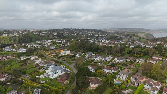 Aerial view of Torquay town. Torquay is a seaside resort town on the English Channel in Devon, south west England. Known for beaches such as Babbacombe and cliffside Oddicombe. Drone POV exploration.