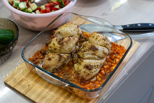 Deliciously Roasted Chicken Breasts Served on a Bed of Flavorful Vegetables, Perfect for a Family Dinner or a Special Occasion