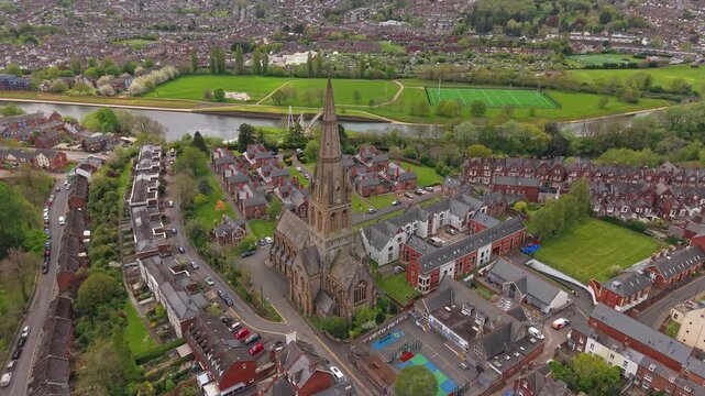 Aerial view of Exeter, which is an ancient city on the River Exe in southwest England. Drone POV of St Michael and All Angels Church, on Mount Dinham in Exeter is an Anglican church in Devon, England.