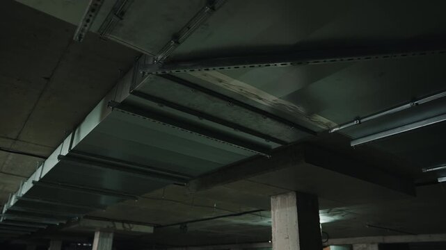 Industrial ceiling ventilation ducts in parking structure close up