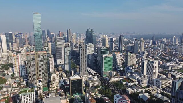 Aerial high view of Bangkok city, urban skyscrapers and office buildings in business district, Thailand, panorama 4k