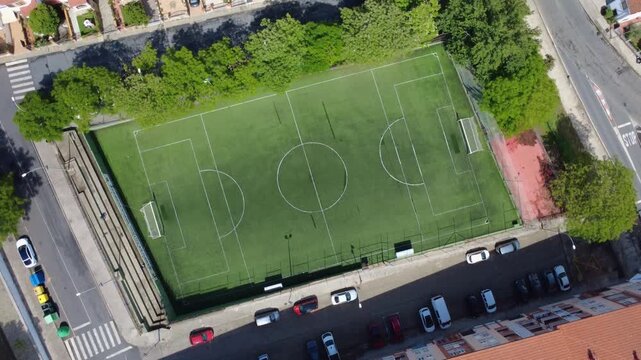 High view Spinning overhead wide shot of a urban football field