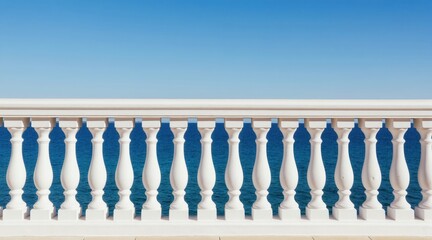 Obraz premium White balustrade overlooks calm blue ocean and clear sky. Classic railing provides a serene view of the sea and coast. Peaceful waterfront terrace offers perfect vacation spot.