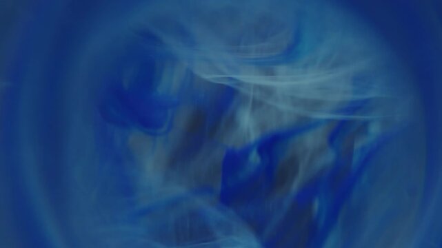 Smoke explosion defocused. Pigment splash. Blue gray paint blot floating in water. Cloud round ring frame abstract color steam art background.