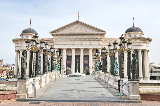 
Skopje, North Macedonia - 31.03.2024: Archaeological Museum of Macedonia and Bridge of the Civilizations in downtown of Skopje, on a sunny morning during spring. 