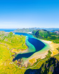 Aerial vertical view of the fjords in Lofoten islands, Norway. Drone view from air. Scenic arctic landscape with high peaks, blue ocean and northern nature. © biletskiyevgeniy