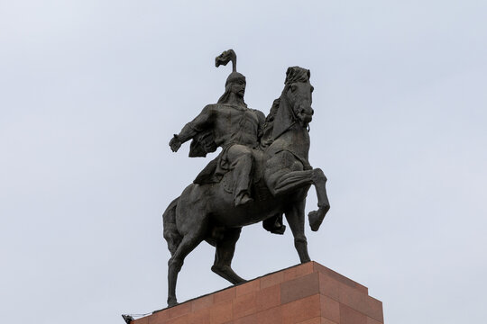 Equestrian monument of Manas on Ala-Too Square, Chuy Region, Kyrgyzstan, viewed from below against an overcast sky