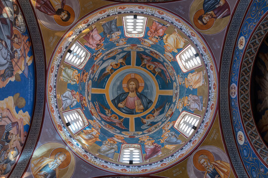 Upward view of the painted dome with Orthodox Christian frescoes and icons inside the Church of St. Jovan Vladimir in Bar, Montenegro, showing ornate religious art