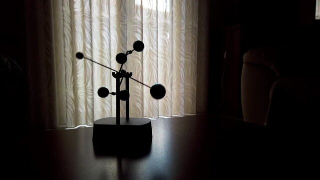 Minimalist perpetual motion silhouette creating endless rhythmic movement