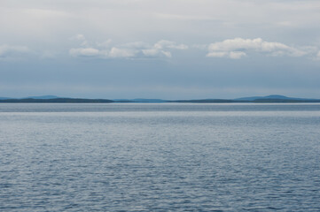 Obraz premium Scenery of forested islands in the wilderness of the lake Inari, Lapland, Finland in summer