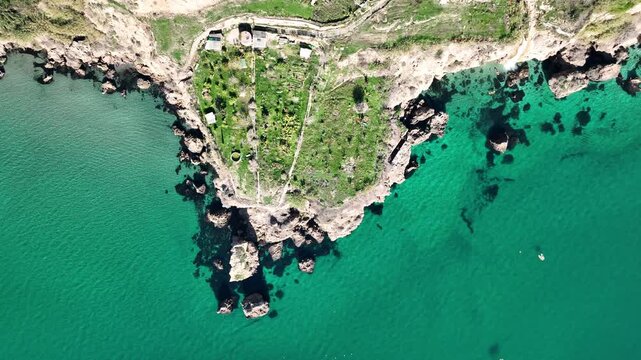 Cinematic Drone Pan Over Turquoise Mediterranean Sea and Rocky Cliffs Near Nerja, Andalusia, Spain