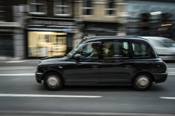 Naklejka premium Moving Taxi on a street of London.